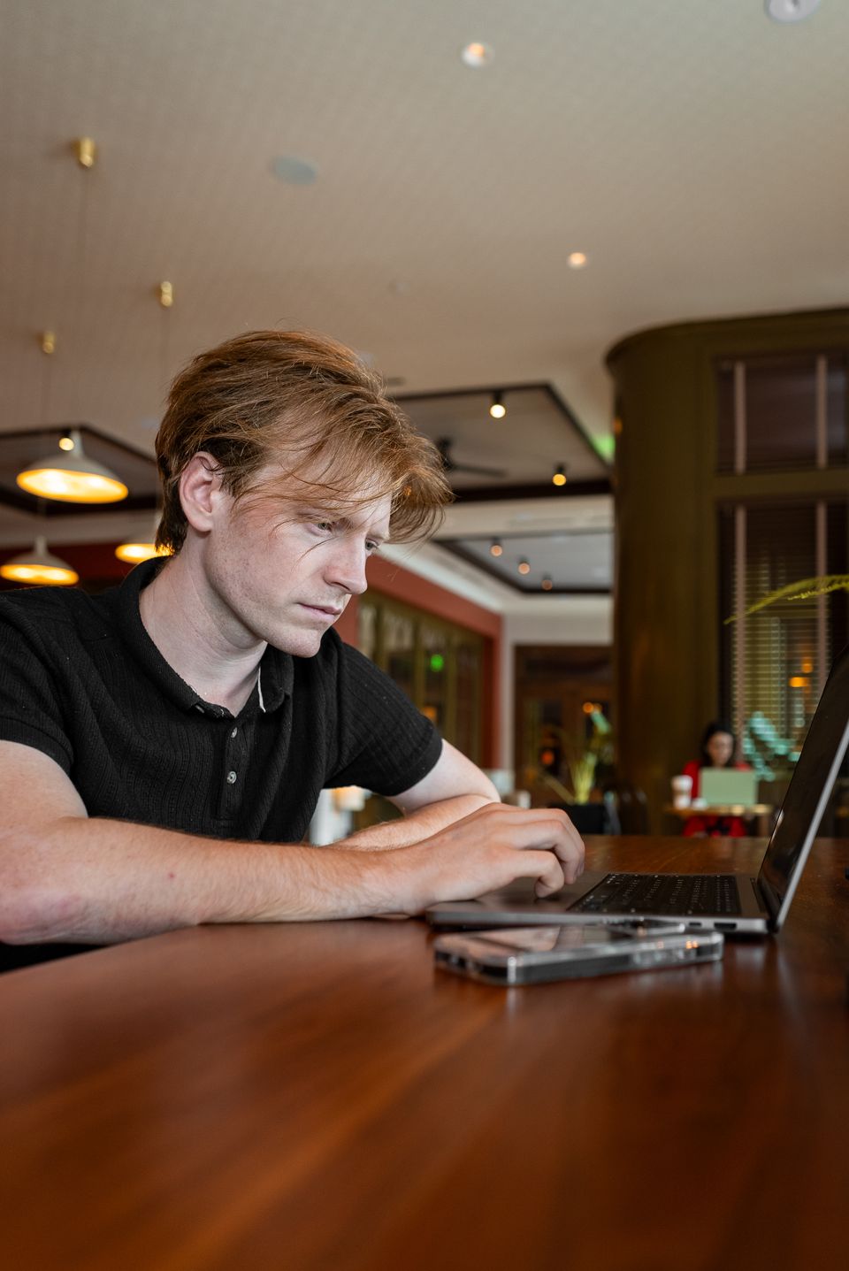 Tyler Strader working on a laptop.