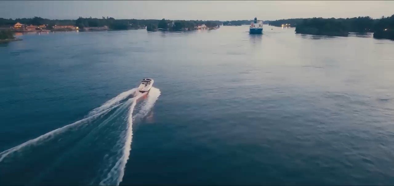A boat leaves a wake across open water, filmed for FOIL.